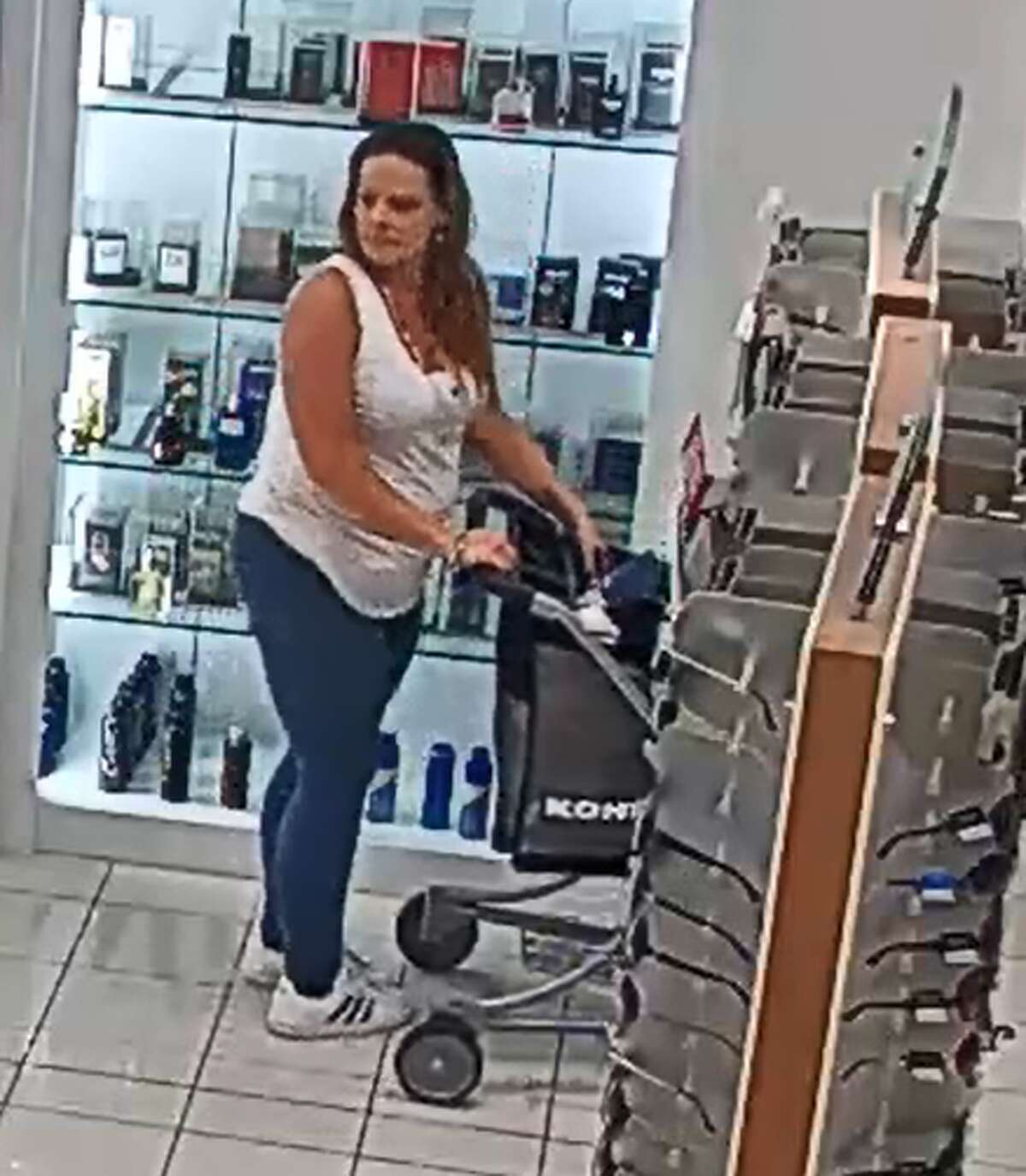 The woman captured by surveillance cameras is accused of stealing $817.50 worth of merchandise from Kohls.