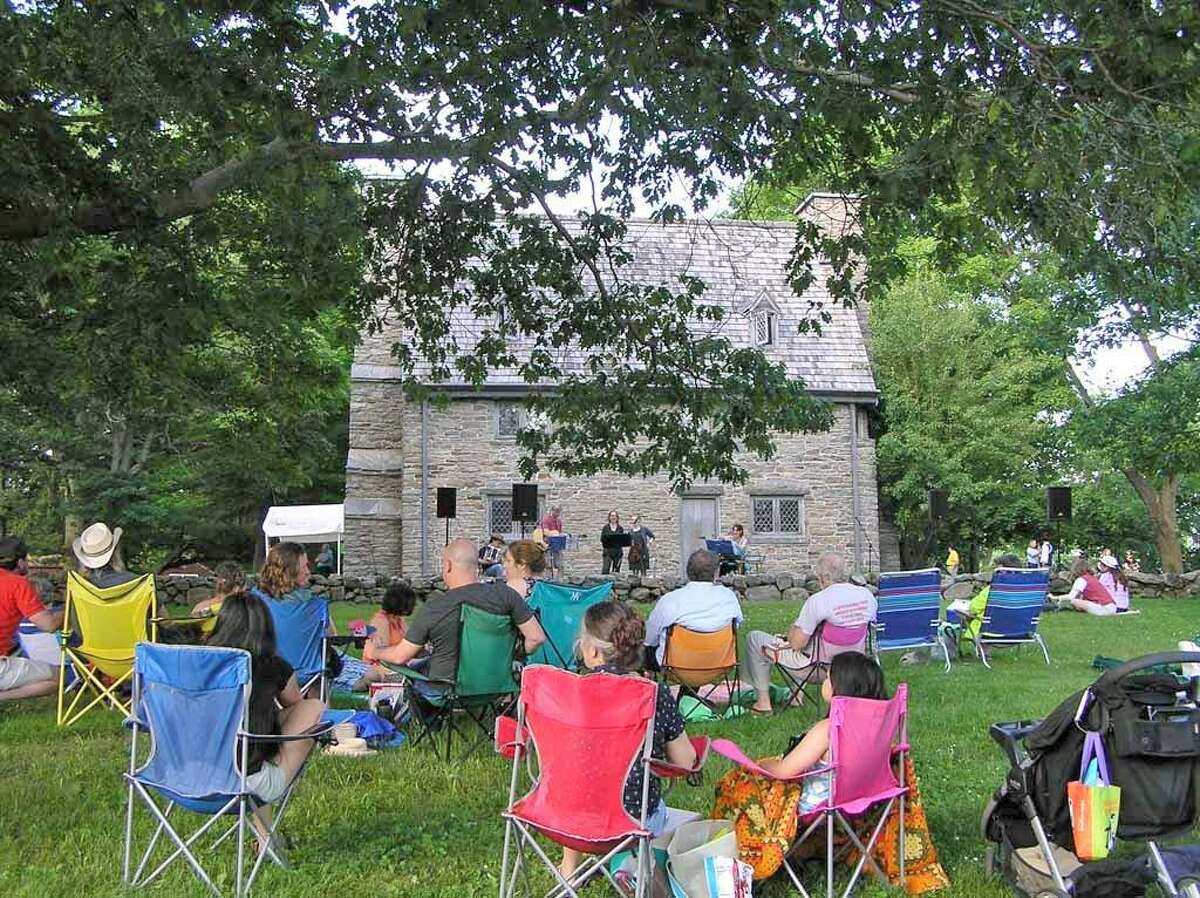 Make Music Day is celebrated June 21 from 4 to 8 p.m. at the Henry Whitfield State Museum in Guilford, shown during last year’s event.