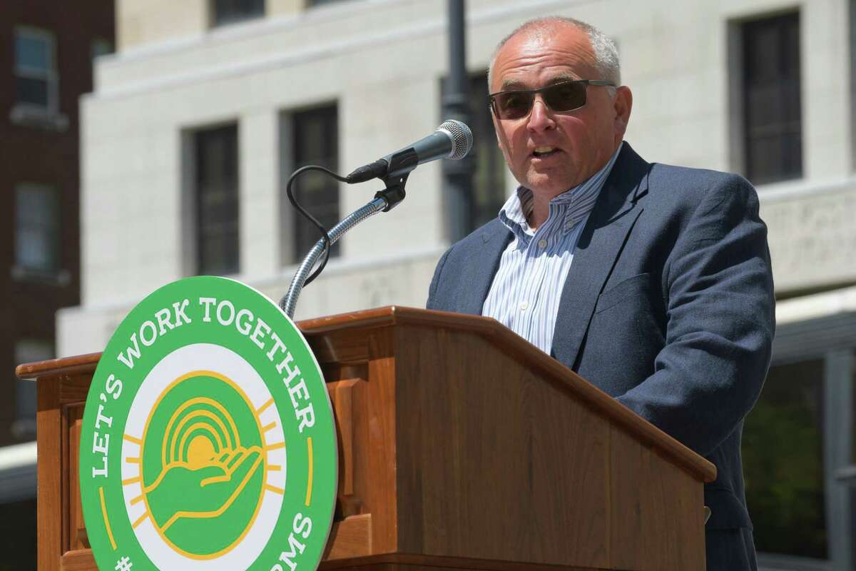David Fisher, the New York Farm Bureau president, addresses those gathered for a rally by farm owners and farm workers on Wednesday, June 12, 2019, in Albany, N.Y. Owners and workers called on legislators to find common ground on proposed legislation that would impose wage and employment mandates. Those taking part in the rally said that the proposed legislation could actually cut workers hours and force farmer to raise prices, hurting sales. (Paul Buckowski/Times Union)