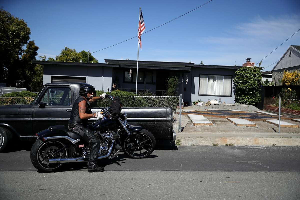EL SOBRANTE, CALIFORNIA - JUNE 05: Steve Johnson sits on his motorcycle in front of his home where he has constructed a design in his yard that resembles a swastika on June 05, 2019 in El Sobrante, California. People living in a San Francisco Bay Area suburb are upset that homeowner Steve Johnson has built a large design in his front yard that resembles a swastika. (Photo by Justin Sullivan/Getty Images)