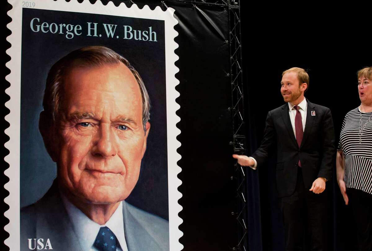 Pierce Bush, grandson of former President George H.W. Bush, and Jean Becker, react to the unveiling ceremony of the Forever Stamp honoring former President George H.W. Bush on Wednesday, June 12, 2019, in College Station. The first-day-of-issue ceremony coincides with Bush's birthday. The Forever stamp features a portrait of the 41st president painted by award-winning artist Michael J. Deas.