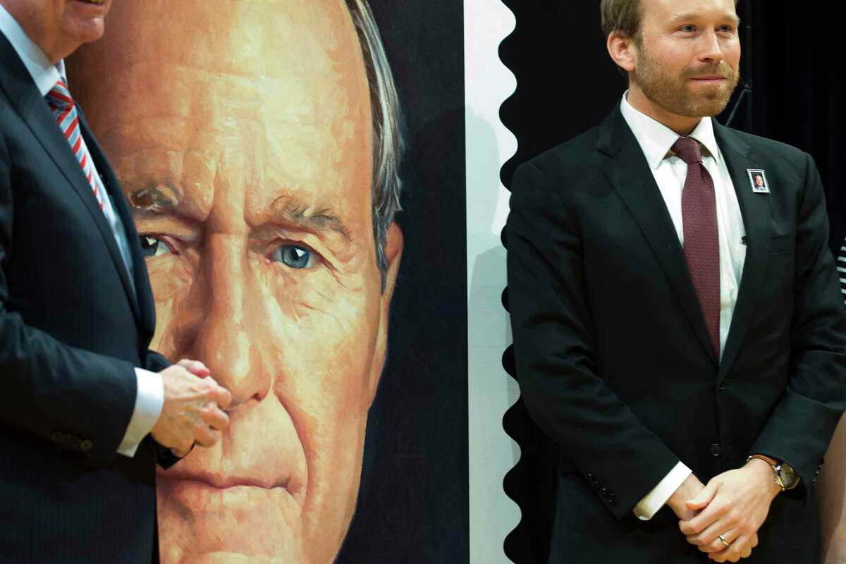 Pierce Bush, grandson of former President George H.W. Bush, stands by the large-scale version of the Forever Stamp honoring former President Bush on Wednesday, June 12, 2019, in College Station. The first-day-of-issue ceremony coincides with Bush's birthday. The Forever stamp features a portrait of the 41st president painted by award-winning artist Michael J. Deas.