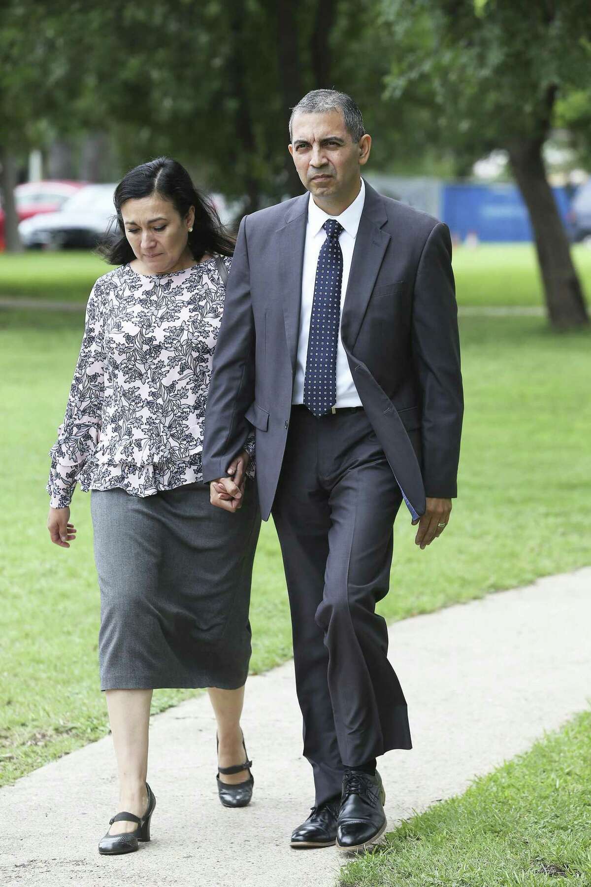 Enrique Gonzalez walks from the federal courthouse with his wife Gladys Gonzalez on Tuesday after he was found guilty on lewd behavior charges aboard an airliner earlier this year. Friday, he was fined $500 but no jail time.