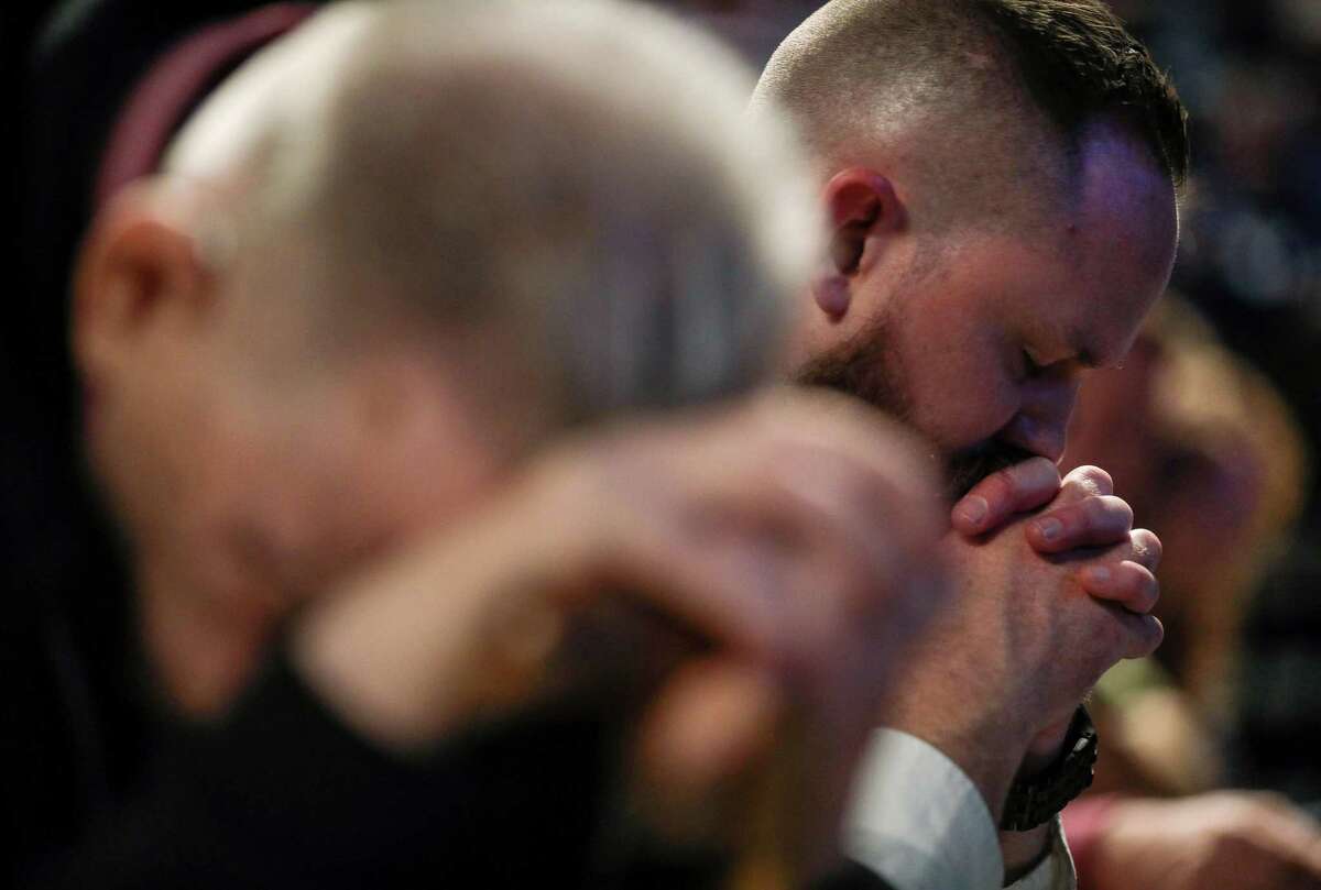 Joel Miller, a missions and outreach pastor, prays on the second day of the Southern Baptist Convention's annual meeting on Wednesday, June 12, 2019, in Birmingham.