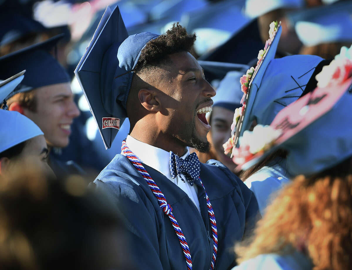 Graduate Charles Flowers cheers on one of the speakers during the Oxford High School Graduation in Oxford, Conn. on Tuesday, June 11, 2019.