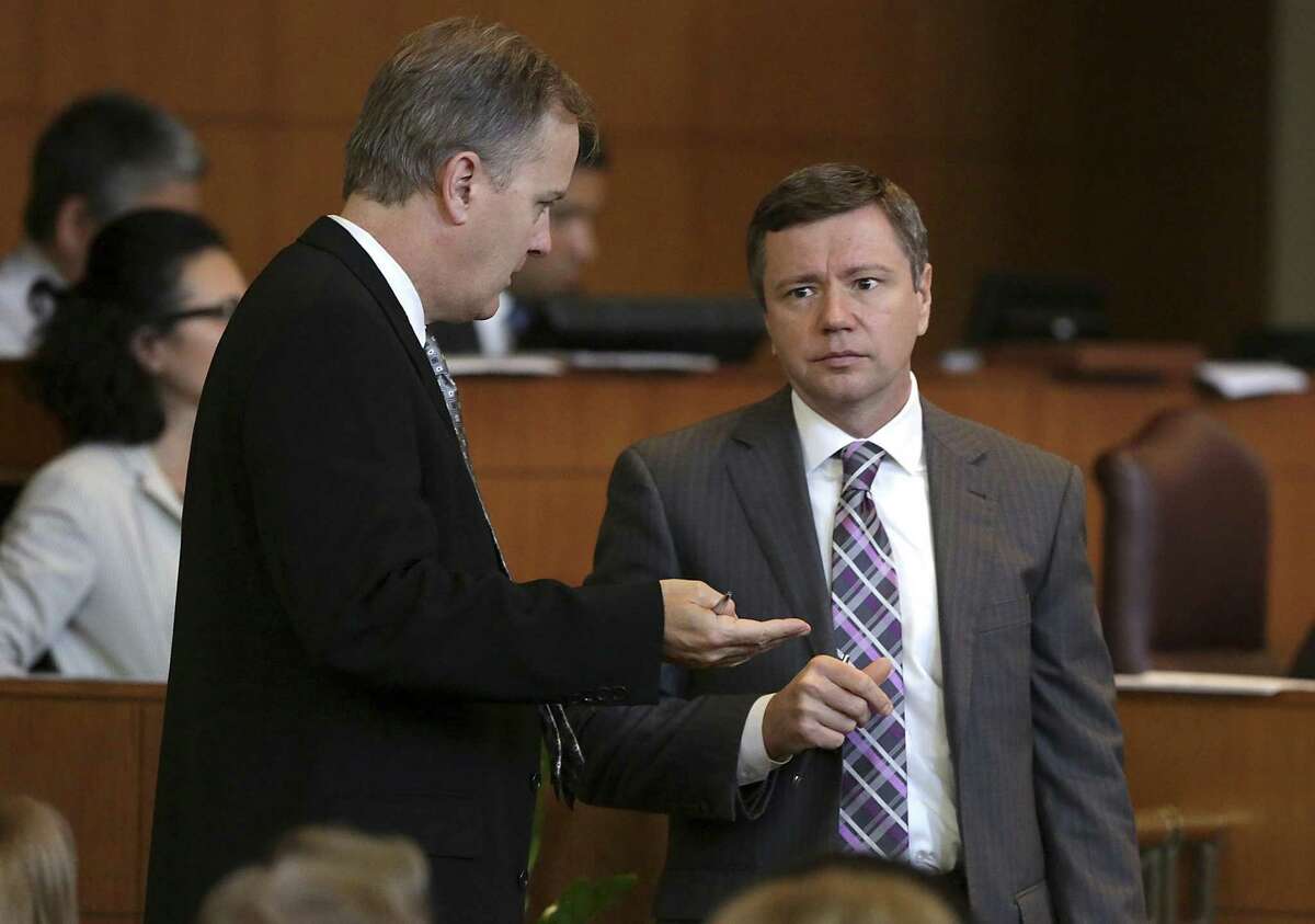 Doug Evanson, left, senior vice president and Chief Financial Officer of SAWS, chats with Ben Gorzell Jr., San Antonio’s Chief Financial Officer, at a City Hall meeting in May 2014. Gorzell said Wednesday that a new state law that will restrict increases in city property tax revenue means a “fundamental shift” in terms of how local governments manage their budgets.
