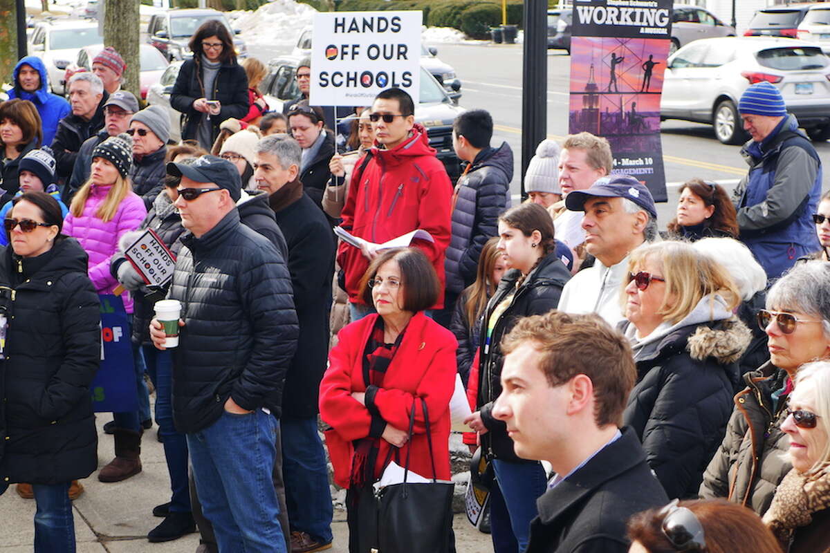 Former state Sen. Toni Boucher, in red, attends the Hands Off Our Schools rally Feb. 23 in Ridgefield. — Peter Yankowski/Hearst Connecticut Media