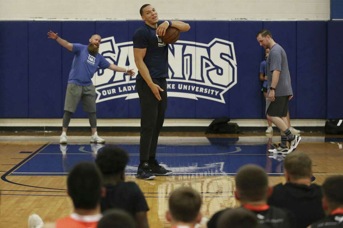 Orlando Magic forward Aaron Gordon encourages teen basketball players to distract him as he shoots free throws during the Train the Mind educational session at Our Lady of the Lake University. Gordon improved his free throw percentage from 40 percent in college to 70 percent as a pro player.