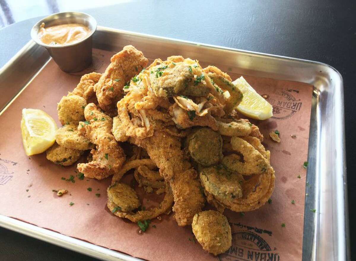 Cajun Debris is a 225 Urban Smoke menu favorite that includes fried catfish, pickles, jalapeños and onion rings in a mash.