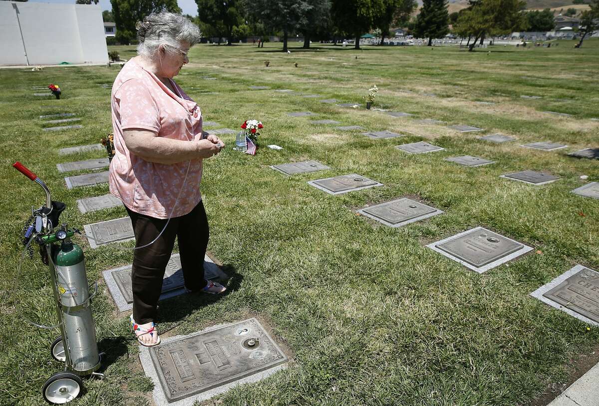 Gloria Tim visits the gravesite where two of her sons are buried at Cedar Lawn Cemetery in Fremont, Calif. on Thursday, June 13, 2019. Tim will soon lay her third son Anthony Gomez to rest after he shot and killed by San Leandro police, who claim he was wielding a machete.