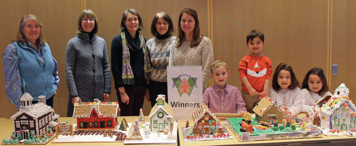 Winners of the How Sweet it is in Wilton! gingerbread house contest, from left, Tina Duncan, Allison Sanders, Kim Mellin, and Kelly Morron representing the Wilton Historical Society, Doris Noonan, Jack Deane, Amir Rahamim, Aurora Gulati and Winnie Gulati. - Janet Crystal photo