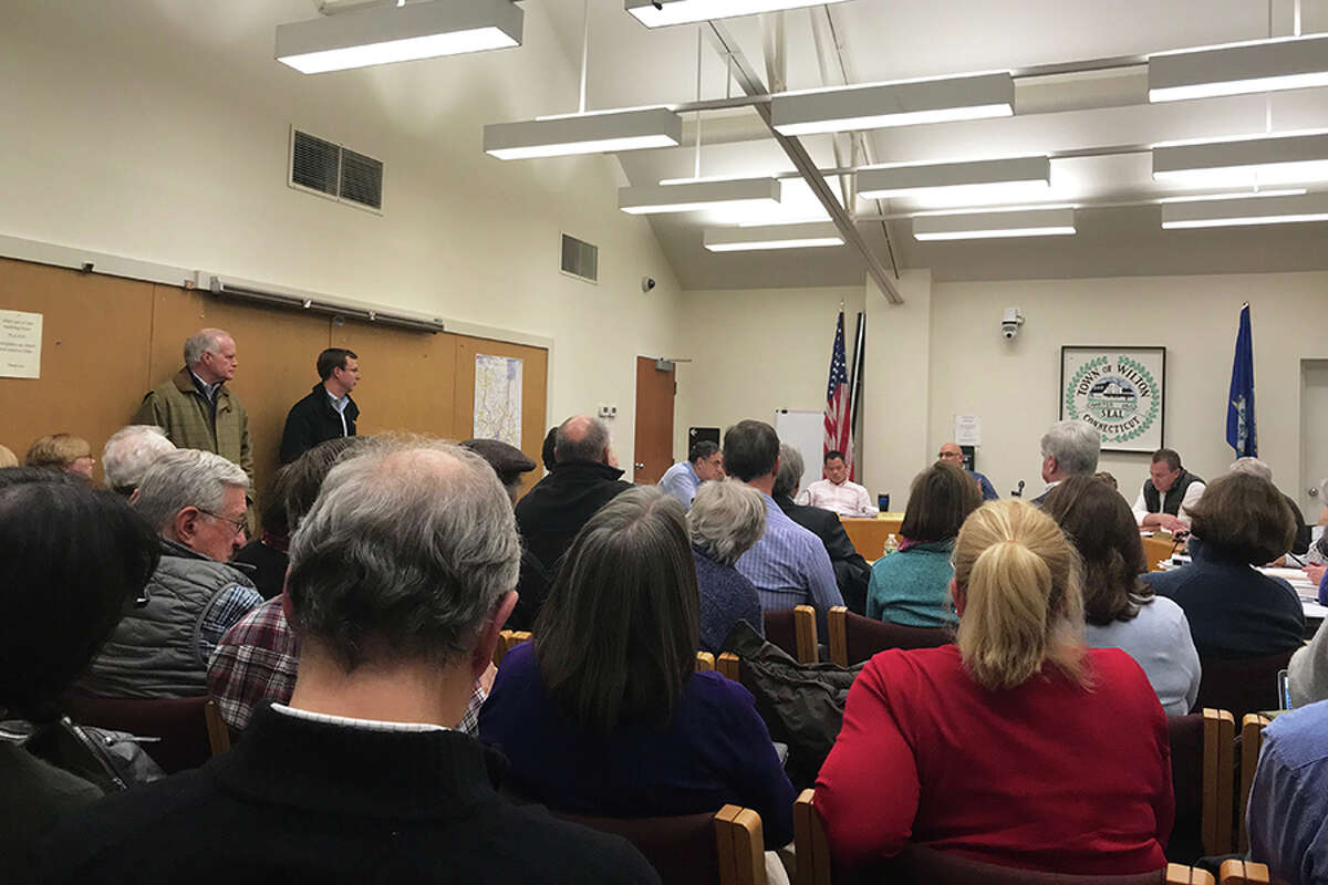 Room A of the town hall annex was standing- room-only for a public hearing on Millstone Property Holdings, LLC's application. - Kendra Baker photo
