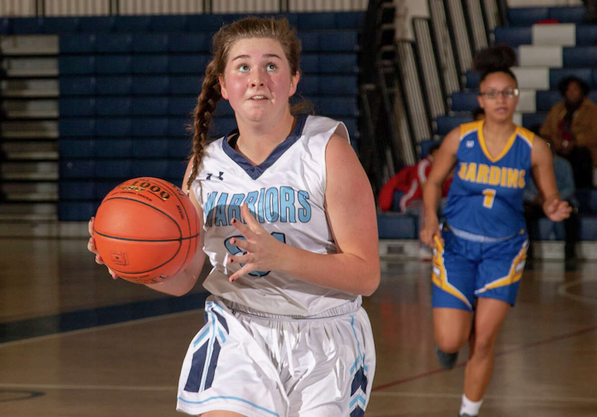 Sophia Strazza drives to the basket in Monday's season-opening win over Harding. - GretchenMcMahonPhotography.com