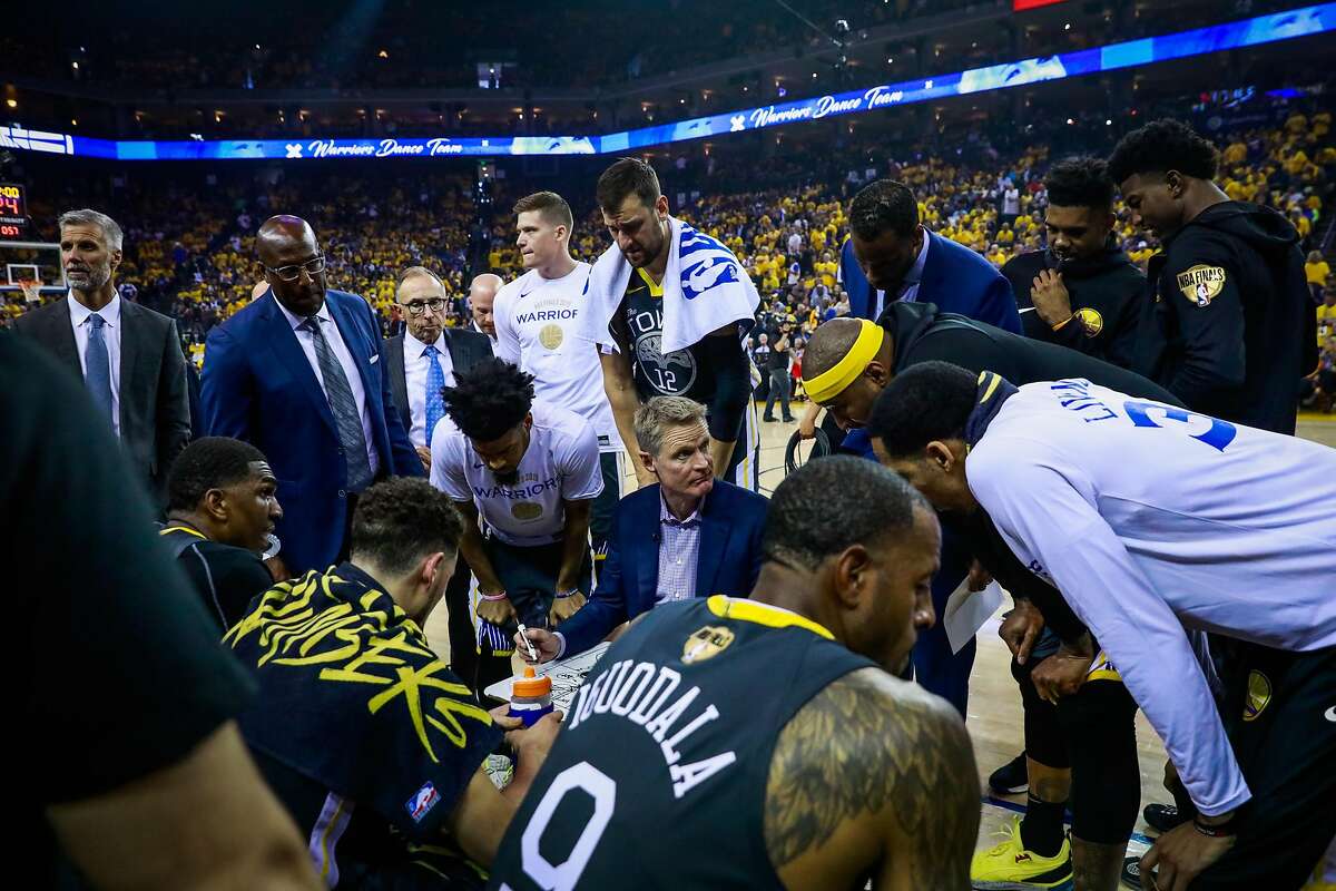 Coach Steve Kerr speaks to his players during the first half of Game 6 of the NBA Finals between the Golden State Warriors and the Toronto Raptors in Oakland, California, on Thursday, June 13, 2019.