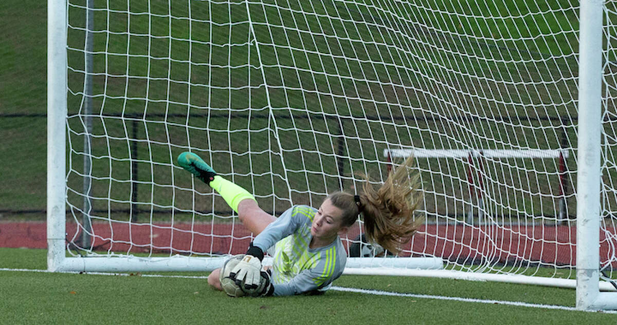 Freshman goalie Erynn Floyd secured Wilton's 2-1 upset win over St. Joseph with this save in the second round of penalty kicks. — GretchenMcMahonPhotography.com