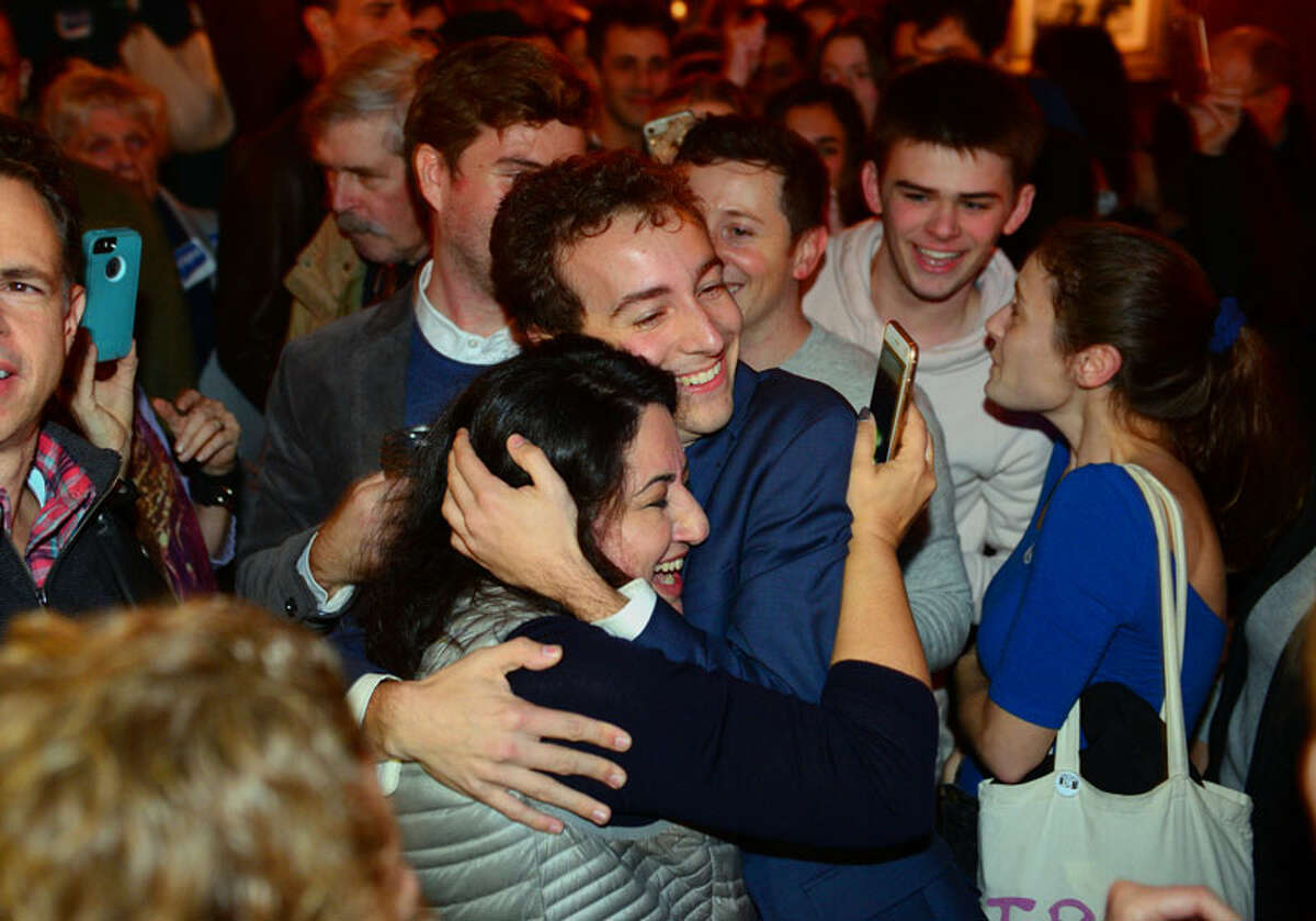 Democrat Will Haskell hugs a supporter after beating Republican incumbent Toni Boucher during a post election party at the Little Barn in Westport on Tuesday night. — Christian Abraham/Hearst Connecticut Media