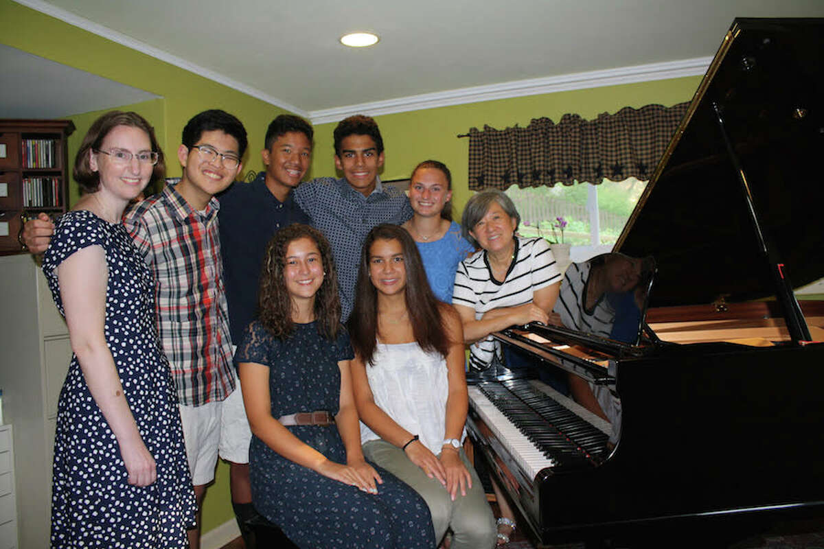 Performing in the Playing by Heart benefit concert are, standing from left, Sharon Kesselman, Woongki Hong, Colin Hong, Jack Nanez, and Peyton Lauricella, students of Kyong Hee Cho. Seated are Alisyn Kercher and Claudia Nanez. Missing from photo is student Martha West-Glynn.