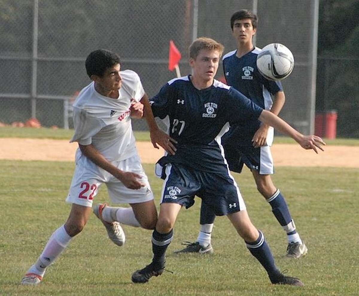 Matt Newfield (right) is one of only seven seniors on this year’s Wilton boys soccer team. — J.B. Cozens photo