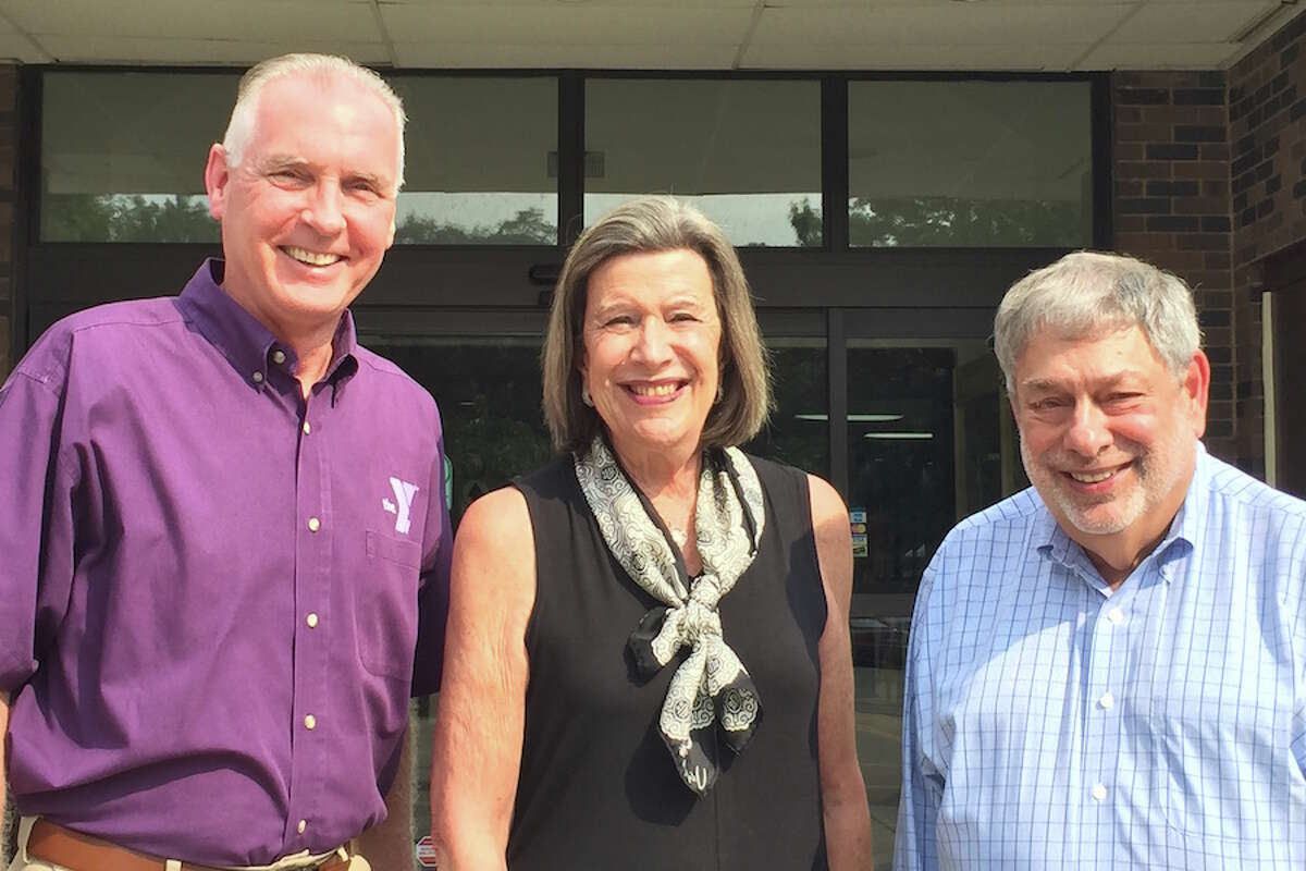 YMCA CEO Robert McDowell, left, joins this year’s Distinguished Citizens Dr. Susan Weinberger of Norwalk and Dick Dubow of Wilton. — Contributed photo