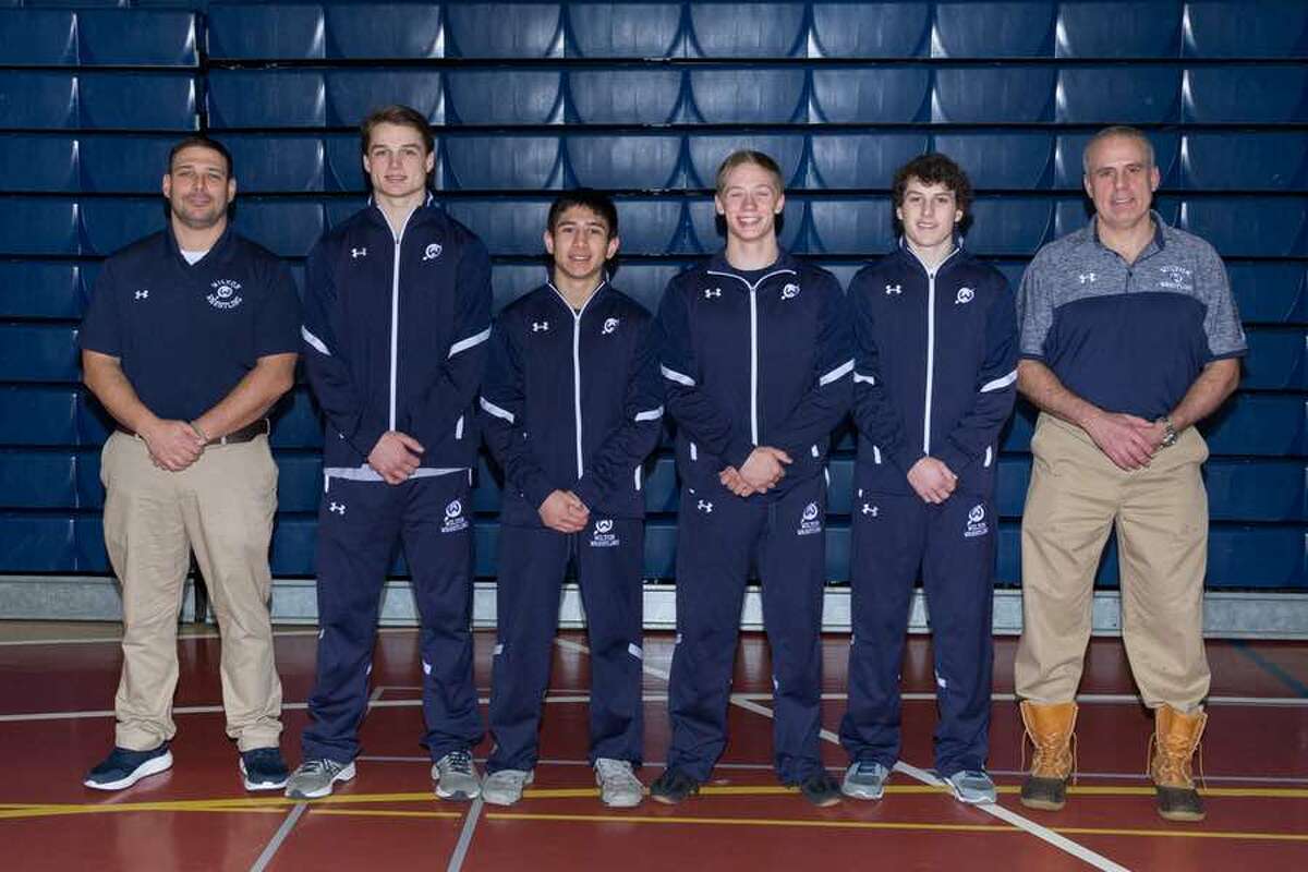 Wilton wrestling head coach John Foldeak (left) with this past season's seniors (from the left) Zach Zeyher, Nick Rende, Seth Warren and Finn McGovern, and assistant coach Brian McGovern. - GretchenMcMahonPhotography.com