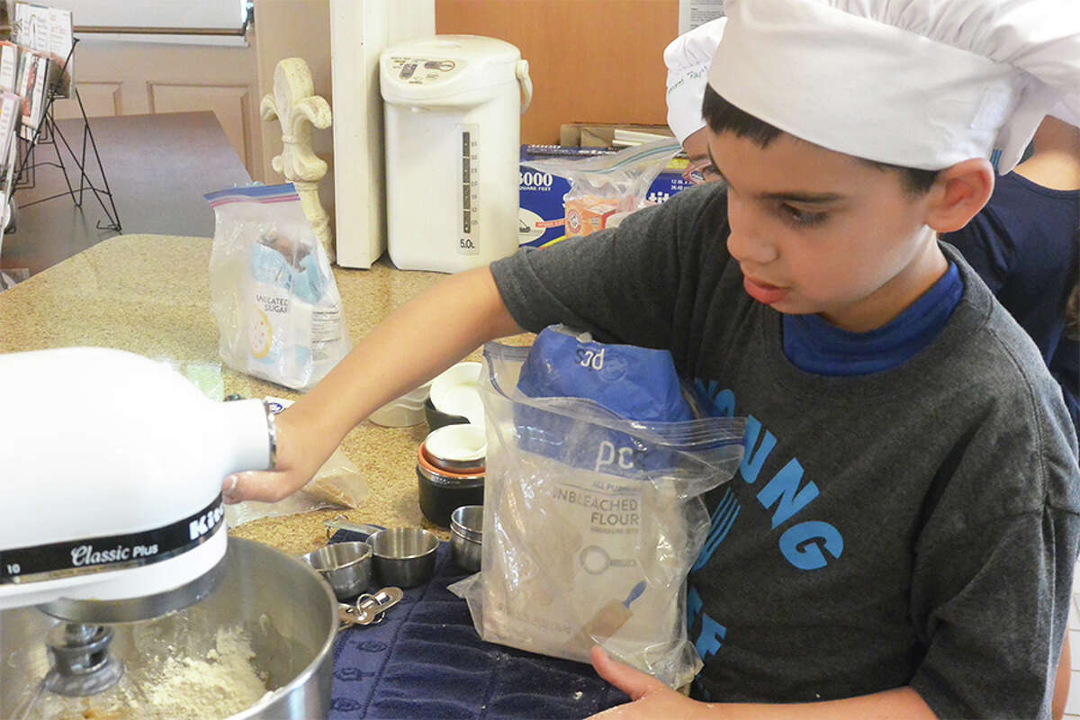 Liam Gallary, 9, of Wilton, mixes up some cookie dough at healthy Kids Cooking Camp. - Tony Spinelli photo