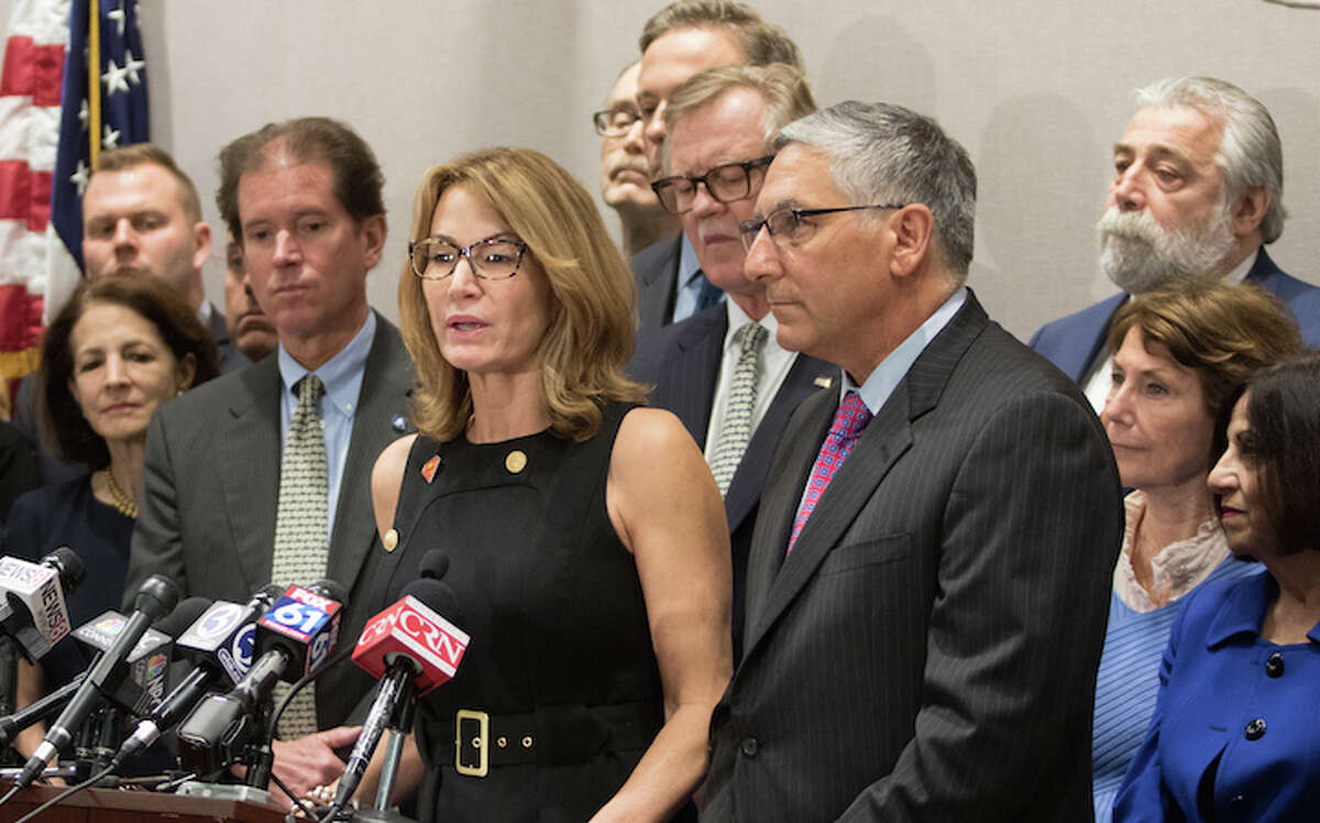 Wilton legislators Gail Lavielle, left, and Toni Boucher, right, join Republican Minority Leader Themis Klarides in making an announcement last year. Klarides will be the guest speaker at the opening of the Republican Town Committee's headquarters in Wilton.