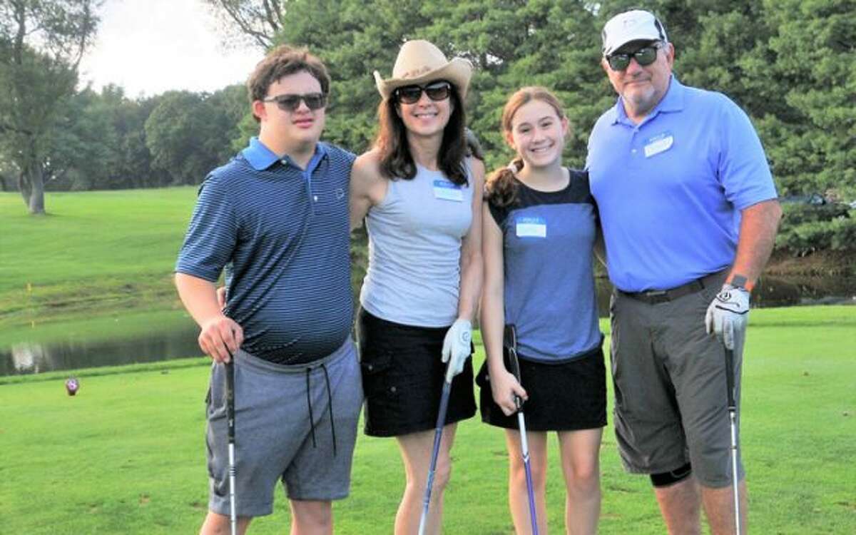 Family enjoying STAR’s benefit Golf Tournament.