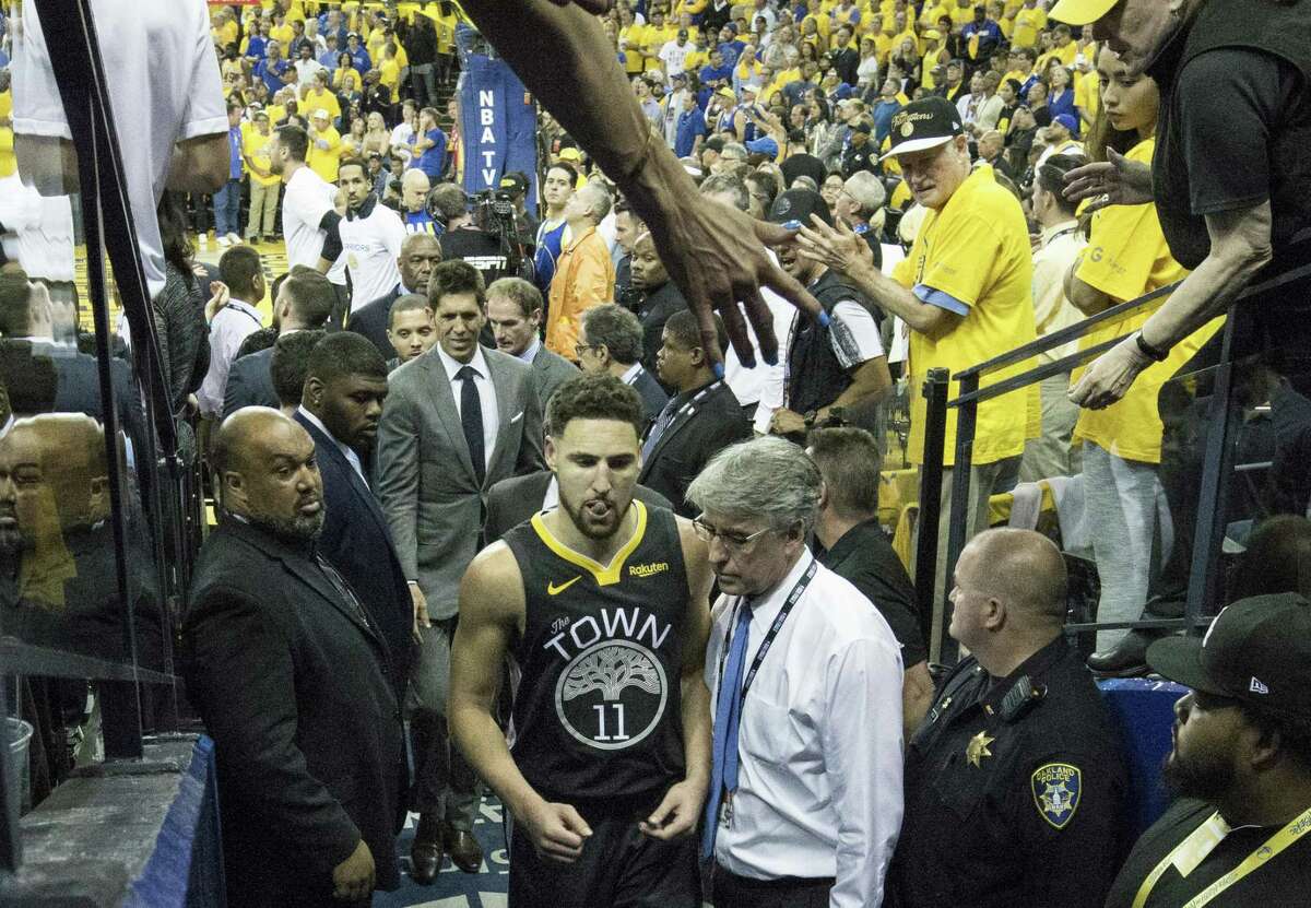 Golden State Warriors’ Klay Thompson leaves the game in the third quarter after sustaining a leg injury during game 6 of the NBA Finals between the Golden State Warriors and the Toronto Raptors at Oracle Arena on Thursday, June 13, 2019 in Oakland, Calif.