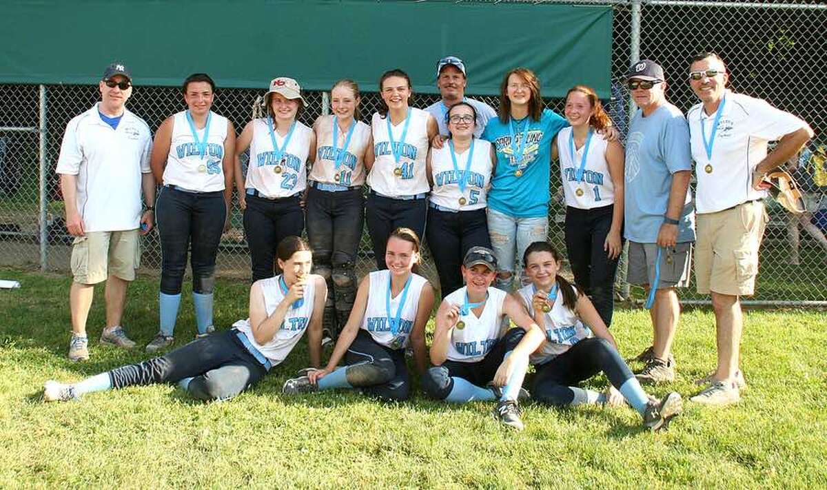 The Wilton 14U girls softball team after winning the Pomperaug tournament last Sunday. From the left, front row: Caitlin Wallace, Samantha Nilsen, Adriana Annese and Jenna Geaney; and back row: coach Mike Wallace, Dakota Kelly, Lauren Mellas, Brooke Bohacs, Elizabeth Butler, coach Anthony Andre, Molly DeLuca, Rebecca Adam, Annabella Andre, coach Mark Bohacs and coach John Kelly. Missing are Christina Sinatra, Kaylee Drago, Nicole Spinelli and head coach Andrea Sidor.