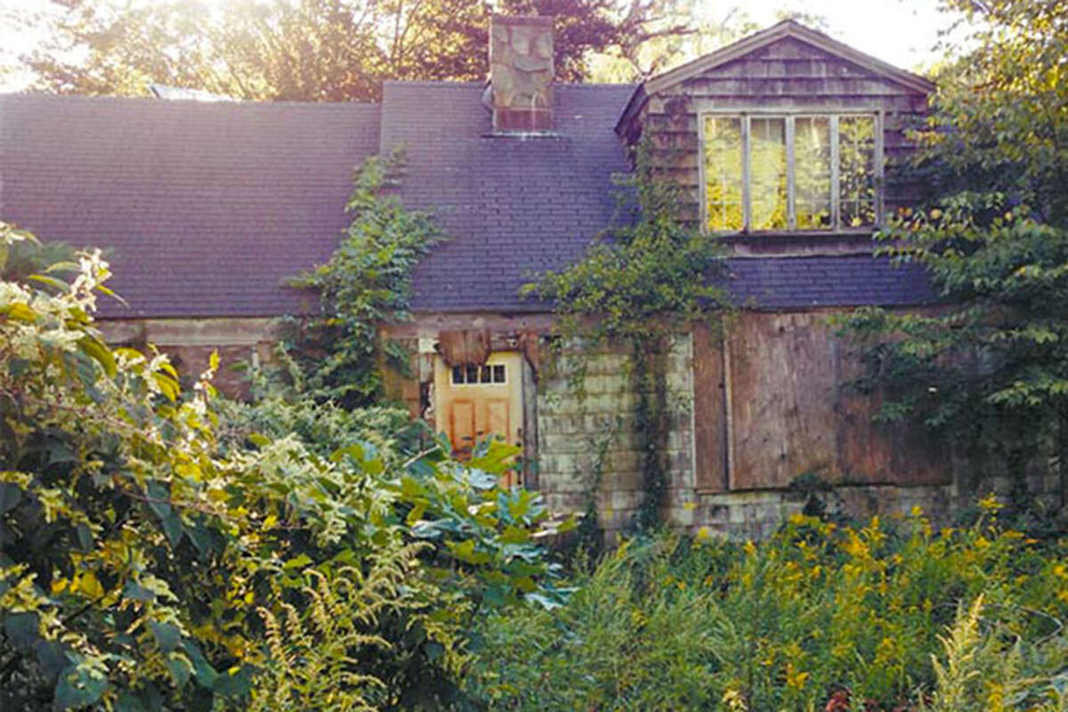 This vacant, deteriorating and overgrown has been cited as an example of a blighted house in the neighboring town of Ridgefield. - Ridgefield Press photo