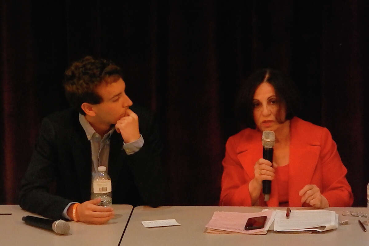 State Senator Toni Boucher speaks as Will Haskell listens at town hall-style meeting on guns. — Kendra Baker photo