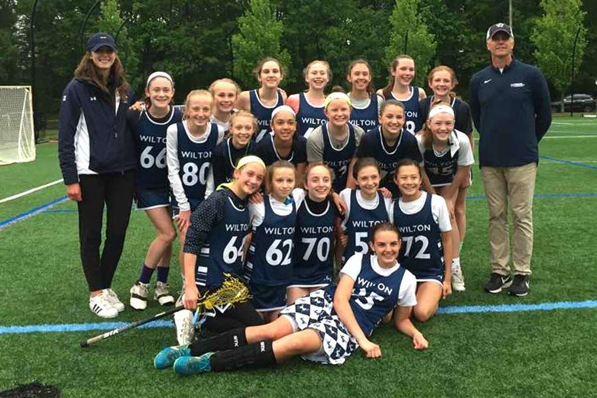 The Wilton 7A girls lacrosse team after wrapping up a 10-0 regular season on May 22 with a 12-6 win over Darien. From left to right, first row: Mary Scally; second row: Isabel DiNanno, Lucy Corry, Olivia Mannino, Mia Cawley and Ella Noonan; third row: Molly Snow, Larsen Burke, Sammy Slough, Whitney Hess, Emerson Pattillo and Darien Lilly; and back row: Coach Maddie Kratz, Hannah Fitzgerald, Maddie Ratcliffe, Ava Fasano, Jane Hulse, Lily Abud, Charlotte Casiraghi, Jill Robert and coach Geoff Kratz.
