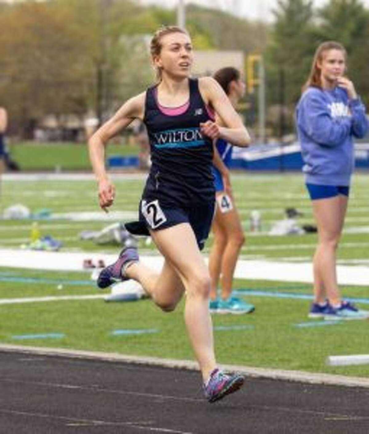 Morgan McCormick broke the Wilton girls track record in the 3200 meters on Monday as she won the event at the FCIAC championships. - GretchenMcMahonPhotography.com