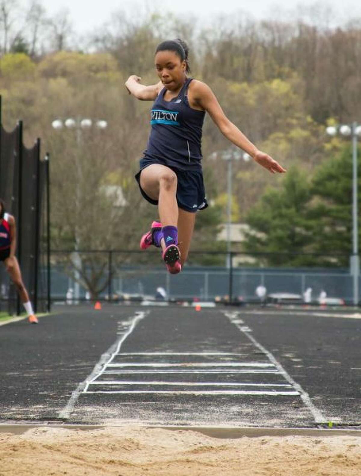 Andreen Reid, shown in action from last season, broke the Wilton High girls long jump for the second time this past Friday night. — GretchenMcMahonPhotography.com