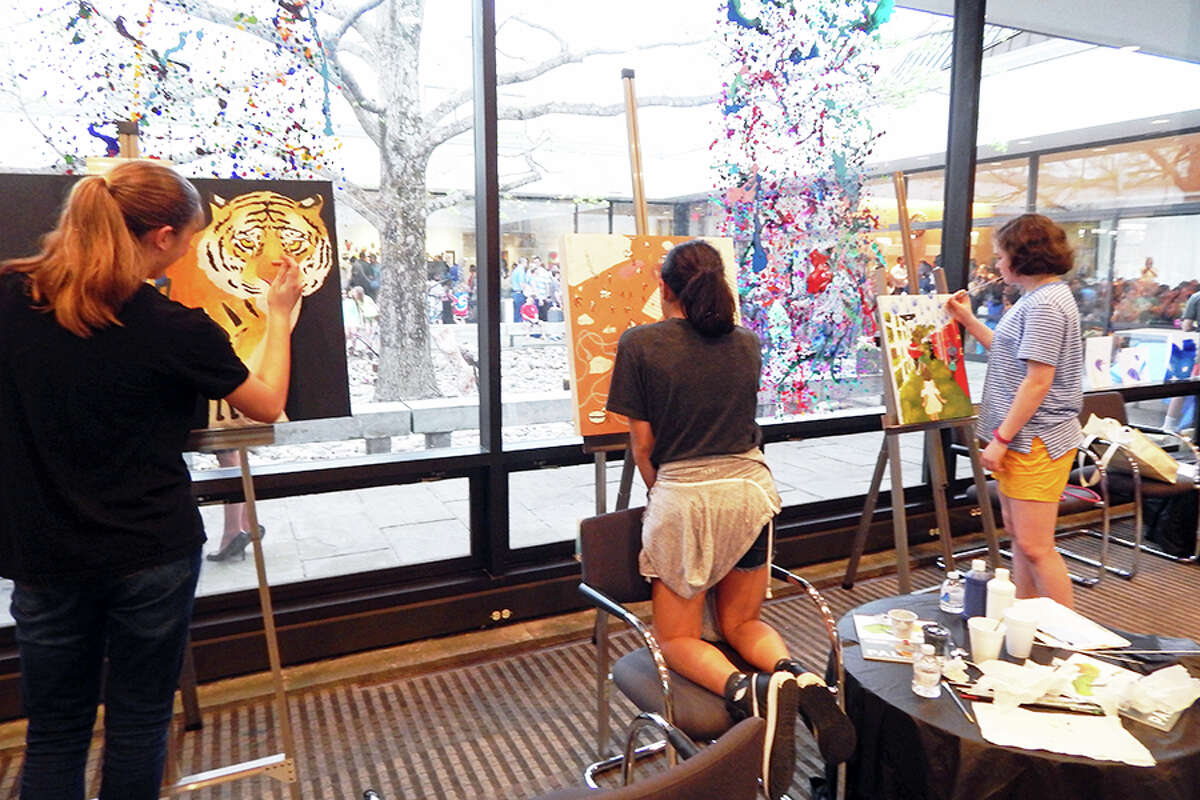 Wilton students creating art during the FAPA Exhibit opening reception.