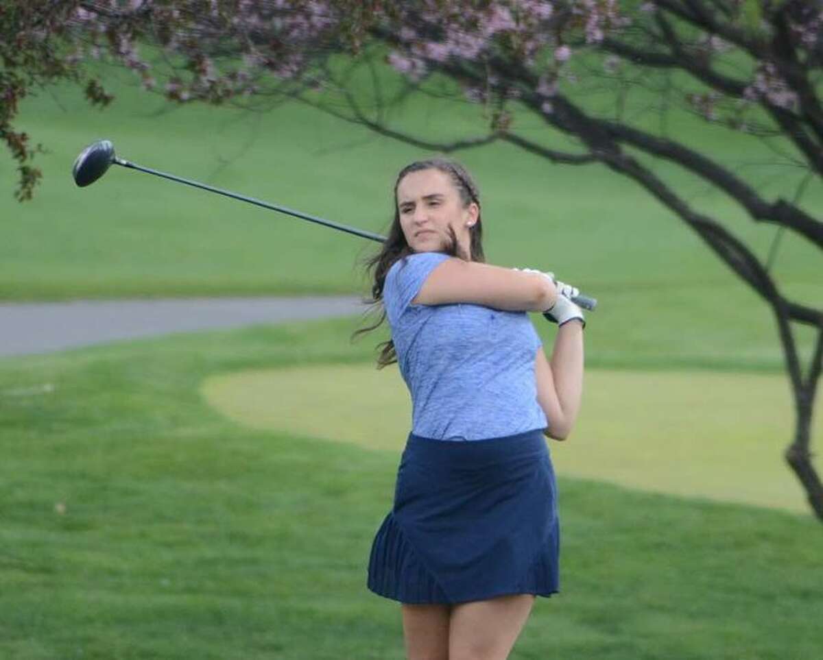 Karli Williams watches her tee shot during the Wilton girls golf team's match on Thursday at Richter Park in Danbury. — J.B. Cozens photo