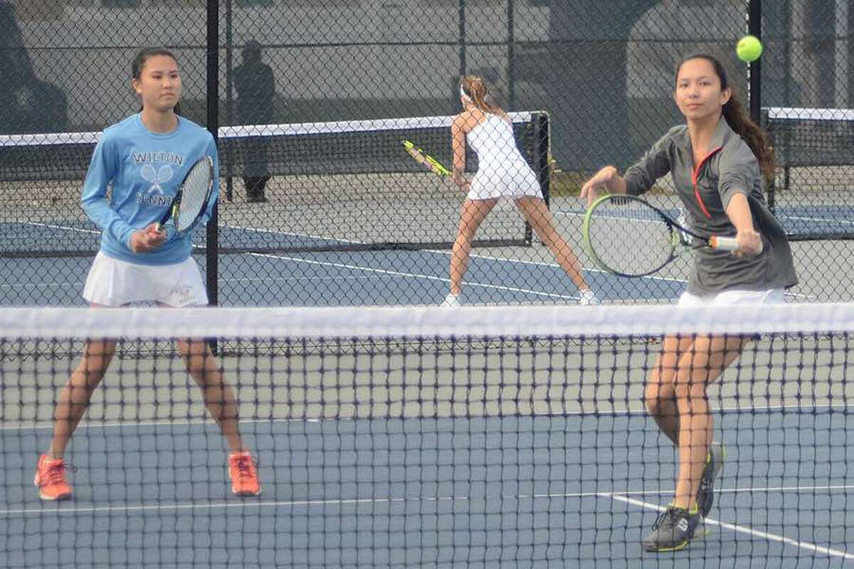 Amber Li and Arden Lee during a Wilton girls tennis first doubles match from earlier in the season. — J.B. Cozens photo