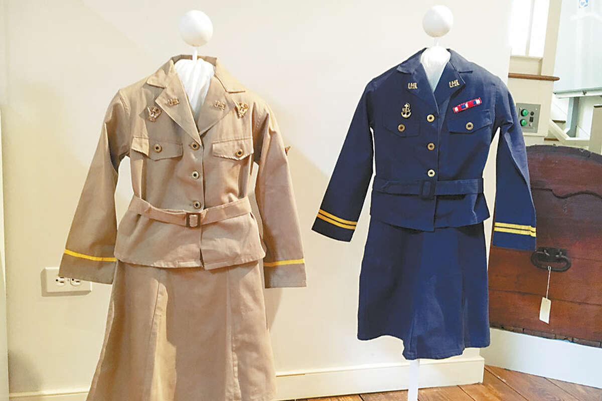 Junior-sized Navy and WACs uniforms are part of the History is Here! Exhibition. — Jeannette Ross photo