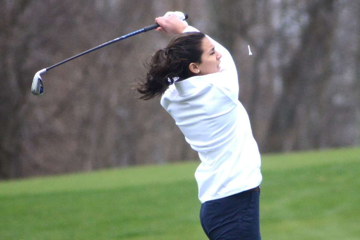 Maya Fazio watches her tee shot on the first hole during the Wilton High girls golf team's match on Tuesday at Silvermine Golf Club. — J.B. Cozens photo