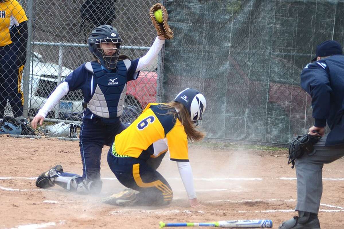 Maya Farrell puts the tag on Weston's Cassidy Nosenzo at the plate during the Wilton softball team's win on Thursday in Weston. — J.B. Cozens photo