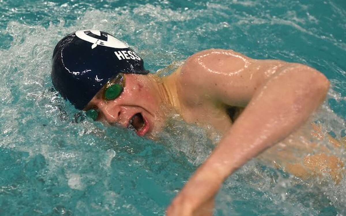 Rory Hess swims a leg in the 400-yard freestyle relay for the Wilton High boys swim team at Sunday's FCIAC championships in Greenwich. — Dave Stewart / HAN Network