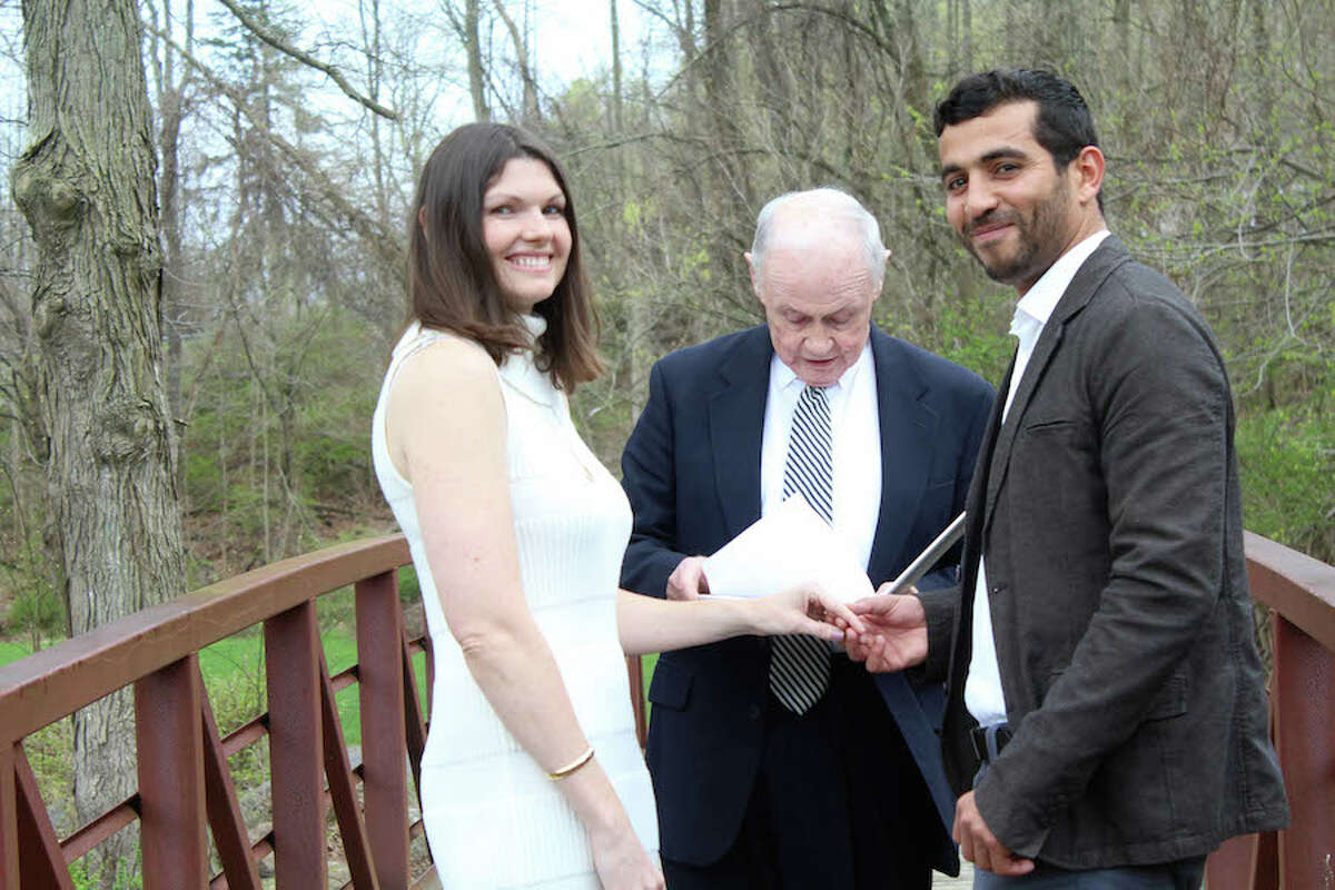 The newly wed Meghan Pollak and her husband Mehdi Sabri, with Charles Flynn.
