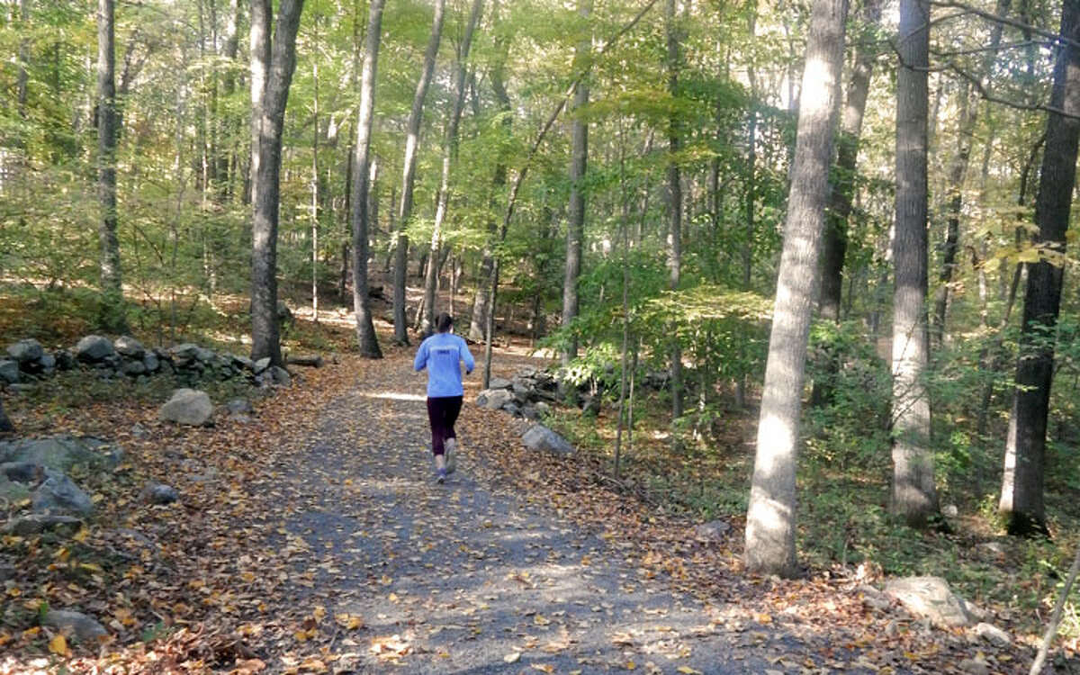 A jogger runs along the Wilton loop of the Norwalk River Valley Trail. Redding is working on having a similar portion of the trail. — Kendra Baker photo