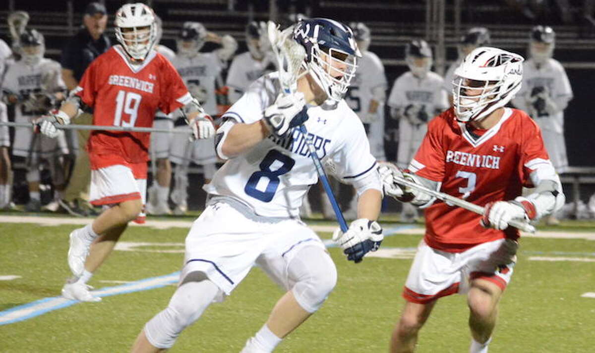 Andrew Luciano looks to get past a Greenwich player in Saturday night's game. — Andy Hutchison photo