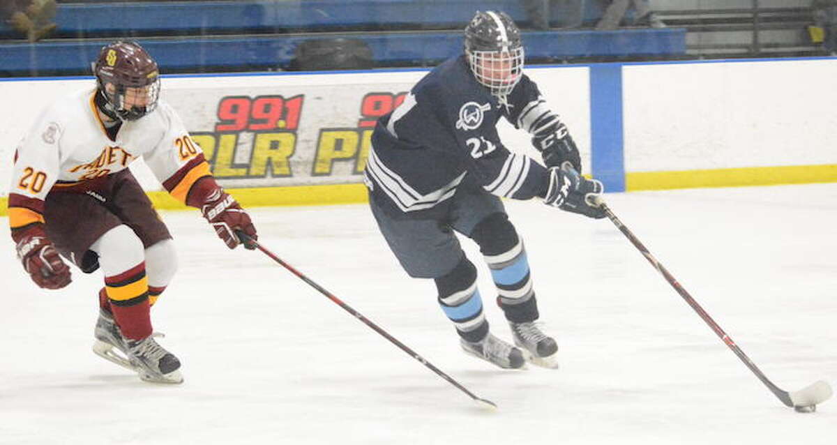 Nico Kouvaris (right) and the Wilton boys hockey team have qualified for the Division III state tournament. — Andy Hutchison photo