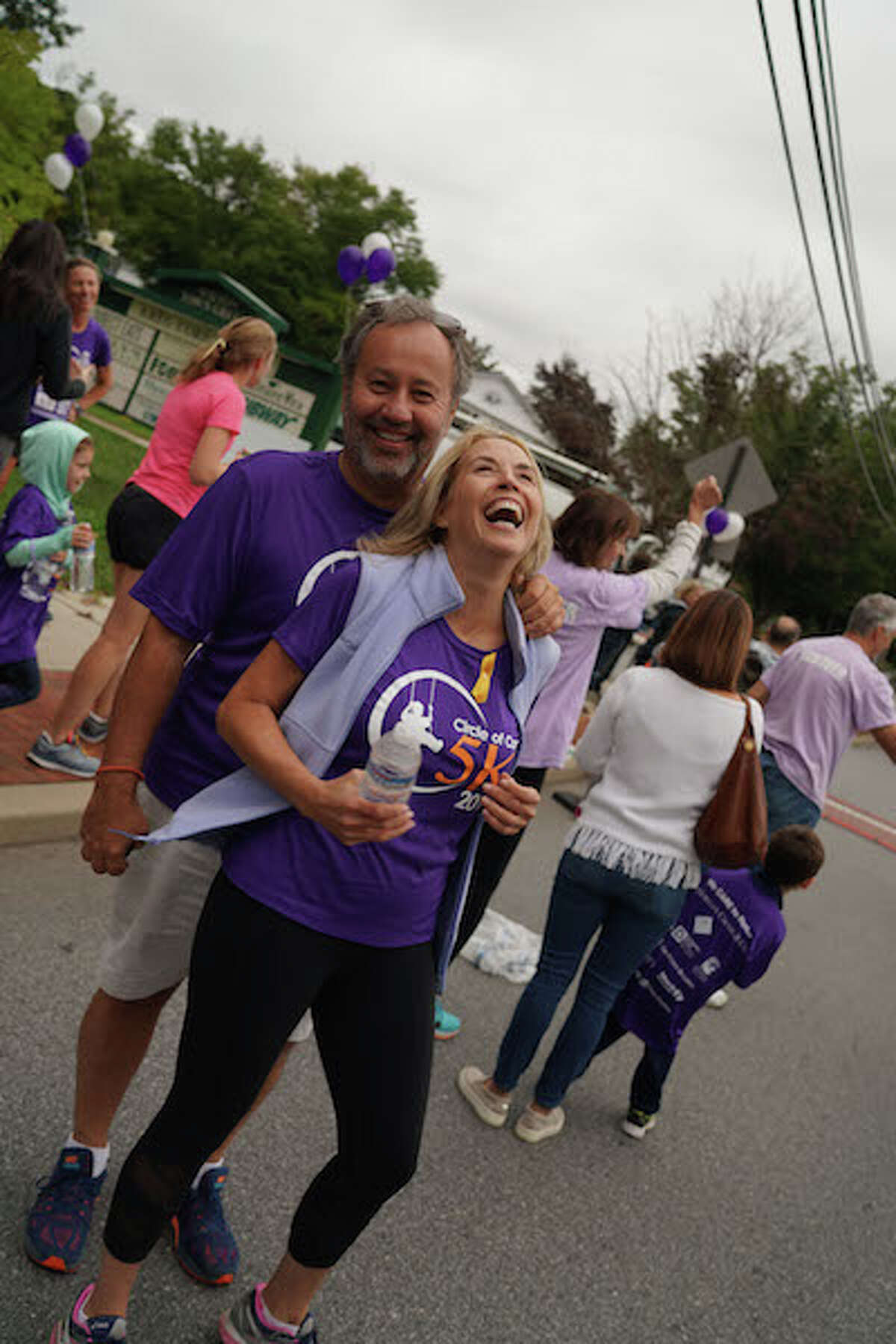 Jeffrey Salguero with his wife, Liz Salguero, at the Circle of Care 5K last September in Wilton Center. - Contributed photo