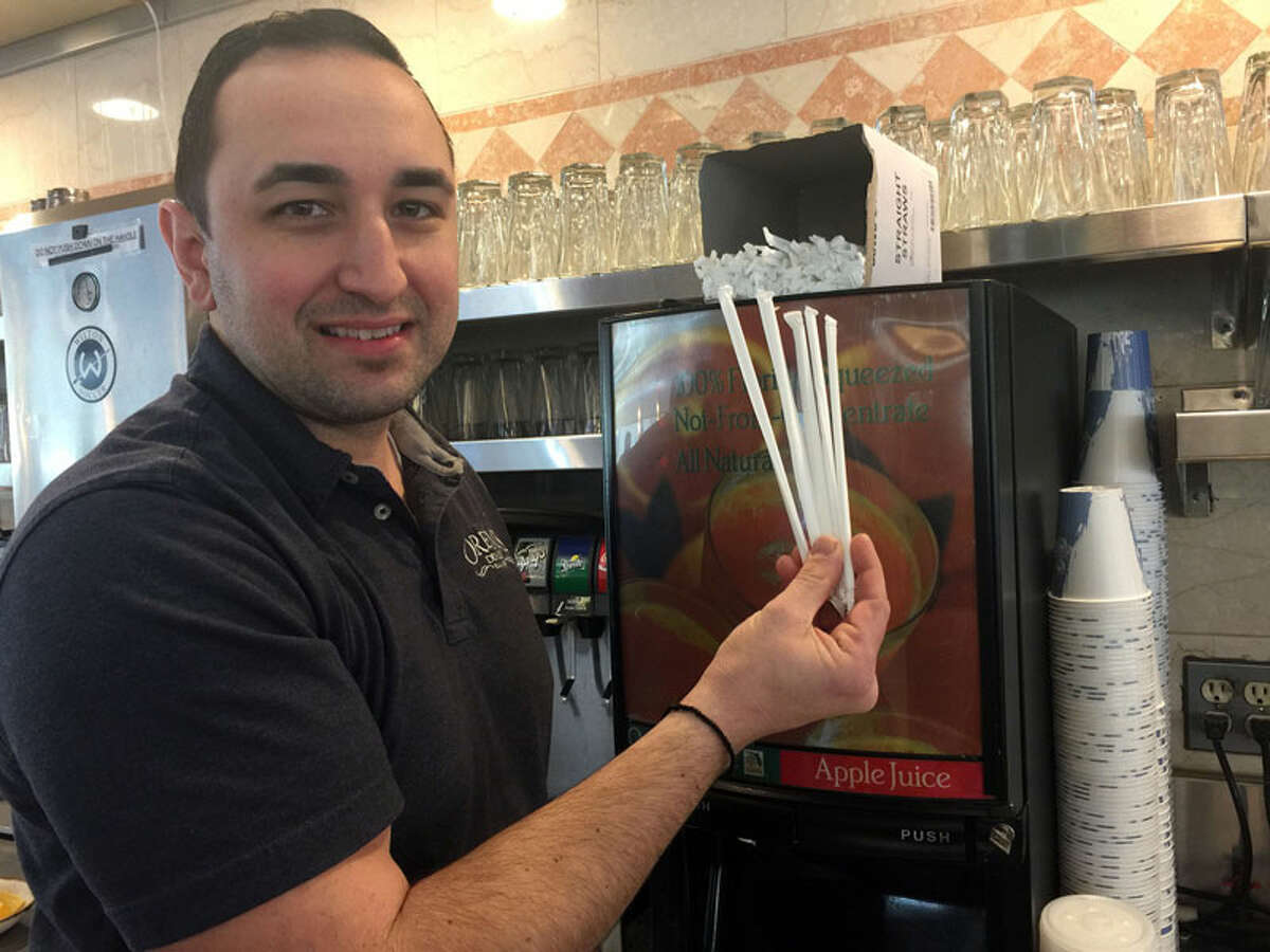 Demetri Papanikolaou, co-owner of Orem’s Diner, may be ordering less straws for his business. — Patricia Gay/Hearst Connecticut Media