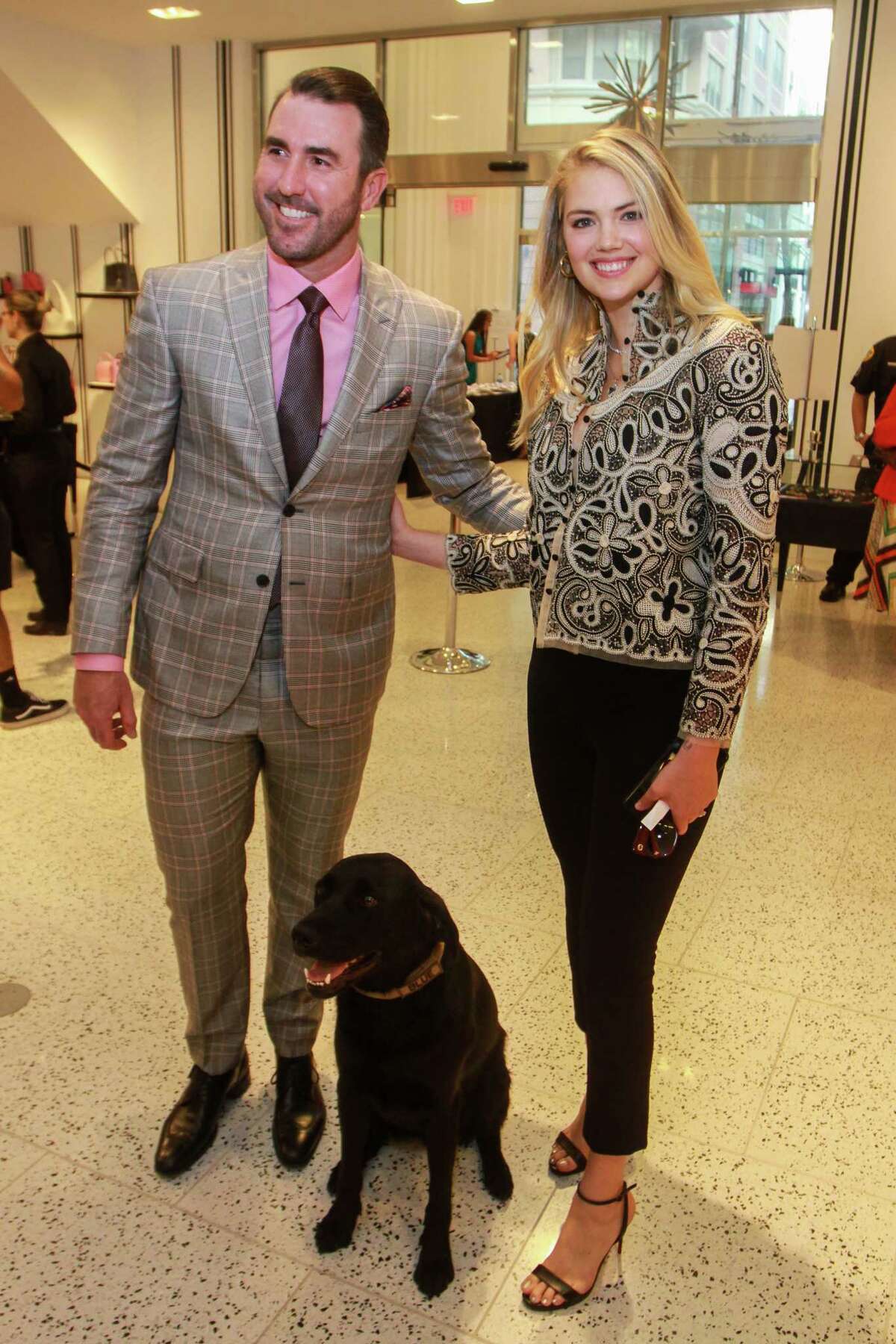 Justin Verlander and Kate Upton with Blue, a rescue dog trained in explosive detection, at Astros Team Up for Kids and K9s at Tootsies.