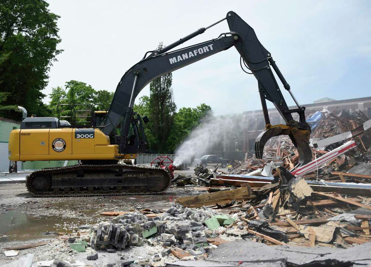 A construction crew begins demolition of the former Pet Pantry building in Greenwich last June. Construction of the new substation is underway and large pieces of equipment are expected late Wednesday morning.