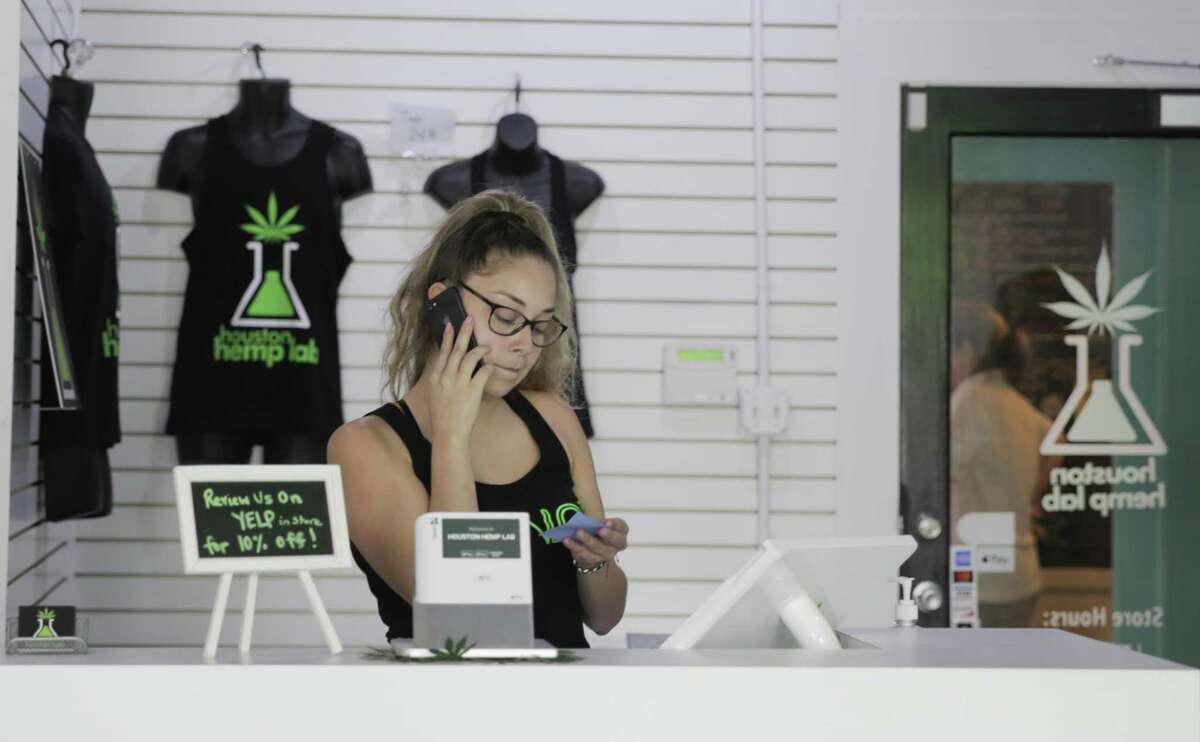 Houston Hemp Lab owner Sophia Romo takes care of some business at the Heights neighborhood CBD store on Wednesday, May 29, 2019 in Houston.